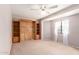 This bedroom boasts a ceiling fan and a built-in Murphy bed with shelving at 44446 N 14Th St, New River, AZ 85087