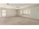 Large bedroom with plush carpet, ceiling fan and lots of natural light at 44446 N 14Th St, New River, AZ 85087