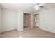 Bedroom featuring neutral walls, carpet, and a closet with metal shelving at 44446 N 14Th St, New River, AZ 85087