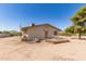 Cozy single-story home featuring a small deck and a neutral color scheme, set against a clear blue sky at 44446 N 14Th St, New River, AZ 85087