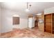 Open kitchen with terracotta tile flooring and white appliances at 44446 N 14Th St, New River, AZ 85087