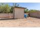 Outside shed sitting on a dirt lot with pump house and equipment at 44446 N 14Th St, New River, AZ 85087