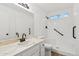 Bathroom featuring a walk-in shower, ample vanity space, and modern fixtures at 4829 E Apache Cir, Phoenix, AZ 85044