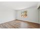 Comfortable bedroom with wood-look floors and a large window allowing plenty of natural light at 4829 E Apache Cir, Phoenix, AZ 85044