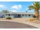 Charming single-story home featuring a well-maintained yard and inviting curb appeal at 4829 E Apache Cir, Phoenix, AZ 85044
