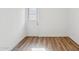Light and bright room with wood-look floors and outdoor access at 4829 E Apache Cir, Phoenix, AZ 85044