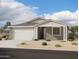 Charming single-story home with a neutral color scheme, well-maintained landscaping, and a two-car garage at 5524 W Piedmont Rd, Laveen, AZ 85339