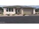 Charming single-story home with a two-car garage, neutral stucco, and well-maintained desert landscaping at 5610 W Hopi Trl, Laveen, AZ 85339