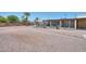 Large backyard with a screened-in patio area, and ample space for outdoor activities at 7645 W Bluefield Ave, Glendale, AZ 85308