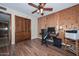 Bedroom with wood look floors and desk at 7645 W Bluefield Ave, Glendale, AZ 85308