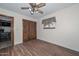 Cozy bedroom with hardwood floors and built-in closet at 7645 W Bluefield Ave, Glendale, AZ 85308