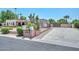 Property featuring a long driveway, desert landscaping, and a gated entrance at 7645 W Bluefield Ave, Glendale, AZ 85308