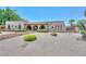 Well-maintained single-story home with desert landscaping and a unique brick exterior design at 7645 W Bluefield Ave, Glendale, AZ 85308