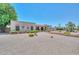 Inviting single-story home with desert landscaping, a red tile roof, and a brick facade at 7645 W Bluefield Ave, Glendale, AZ 85308