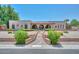 Charming single-story home featuring a brick exterior, arched entryways, and desert landscaping at 7645 W Bluefield Ave, Glendale, AZ 85308