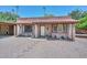 Charming single-story home featuring brick accents, a cozy front porch, and desert landscaping at 7645 W Bluefield Ave, Glendale, AZ 85308