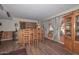 Spacious home bar area features custom woodwork, a wine rack, and ample storage for entertaining guests at 7645 W Bluefield Ave, Glendale, AZ 85308
