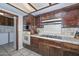 A well-equipped kitchen showcasing tile countertops and wooden cabinetry at 7645 W Bluefield Ave, Glendale, AZ 85308