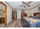 Spacious main bedroom with tasteful decor, a ceiling fan, and ample natural light at 7645 W Bluefield Ave, Glendale, AZ 85308