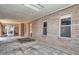 Spacious outdoor patio with brick walls, tile flooring, and ample natural light at 7645 W Bluefield Ave, Glendale, AZ 85308