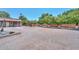 Spacious yard with desert landscaping and mature trees at 7645 W Bluefield Ave, Glendale, AZ 85308