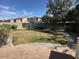 Well-kept backyard featuring lush lawn, partial brickwork, and ample space at 12041 W Carlota Ln, Sun City, AZ 85373