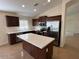 Spacious kitchen with stainless steel appliances and a center island at 12041 W Carlota Ln, Sun City, AZ 85373