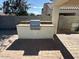 This backyard patio has a built-in grill and brick pavers, offering a great outdoor space at 12041 W Carlota Ln, Sun City, AZ 85373