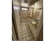 Bathroom featuring granite counters, tile floors, and walk in shower at 18415 N 33Rd Ave, Phoenix, AZ 85053