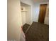 View of closet with hanging shelf and brown flooring at 18415 N 33Rd Ave, Phoenix, AZ 85053