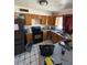 Functional kitchen with stainless steel appliances, wood cabinets, and tile floors at 18415 N 33Rd Ave, Phoenix, AZ 85053