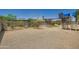 Large backyard with a play structure and potential for creative landscaping at 2164 E Jerome Ave, Mesa, AZ 85204