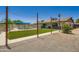Backyard view with pool, artificial turf and outdoor kitchen at 2164 E Jerome Ave, Mesa, AZ 85204