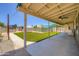Covered patio overlooking a pool area with a playground and artificial turf at 2164 E Jerome Ave, Mesa, AZ 85204