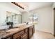 Bathroom featuring double sinks, granite countertops, and modern fixtures at 2164 E Jerome Ave, Mesa, AZ 85204