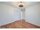 Bedroom featuring a ceiling fan, hardwood floors and a closet at 2164 E Jerome Ave, Mesa, AZ 85204
