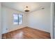 Bedroom featuring a ceiling fan, hardwood floors and a window at 2164 E Jerome Ave, Mesa, AZ 85204
