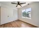 Bedroom featuring a ceiling fan, hardwood floors and a closet at 2164 E Jerome Ave, Mesa, AZ 85204