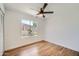 Bedroom featuring a ceiling fan, hardwood floors and a window at 2164 E Jerome Ave, Mesa, AZ 85204