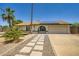 Charming single-Gathering home featuring desert landscaping, a two car garage, and solar panels at 2164 E Jerome Ave, Mesa, AZ 85204