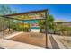 Outdoor gazebo provides a cool retreat near a sparkling pool and lush greenery at 2164 E Jerome Ave, Mesa, AZ 85204