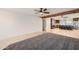 Spacious living room with neutral toned walls, tile flooring, and an open layout with easy access to the kitchen at 2164 E Jerome Ave, Mesa, AZ 85204