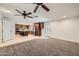 Open-concept living room and kitchen area, great for entertaining guests with stainless steel appliances at 2164 E Jerome Ave, Mesa, AZ 85204