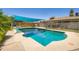 Refreshing pool with a sunshade providing a comfortable outdoor living space at 2164 E Jerome Ave, Mesa, AZ 85204