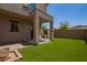 Well-maintained backyard features artificial turf and a covered patio, perfect for outdoor relaxation and entertaining at 2725 E Mine Creek Rd # 1149, Phoenix, AZ 85024