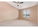 Bright bedroom featuring a large window and neutral tones throughout at 2725 E Mine Creek Rd # 1149, Phoenix, AZ 85024