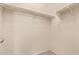 Empty walk-in closet featuring basic shelving for storage solutions at 2725 E Mine Creek Rd # 1149, Phoenix, AZ 85024