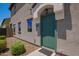 Charming front entrance with a green door, stone accents, and manicured landscaping for a welcoming curb appeal at 2725 E Mine Creek Rd # 1149, Phoenix, AZ 85024