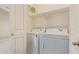 Well-lit laundry room with modern washer and dryer appliances at 2725 E Mine Creek Rd # 1149, Phoenix, AZ 85024