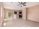 Spacious living room with tiled floors, a ceiling fan, and sliding glass door to backyard at 2725 E Mine Creek Rd # 1149, Phoenix, AZ 85024